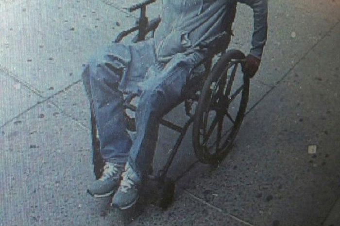 The wheelchair robber making his exit.