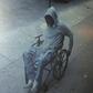 The wheelchair robber making his exit.