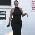Kim Kardashian shows off baby bump in skintight black dress