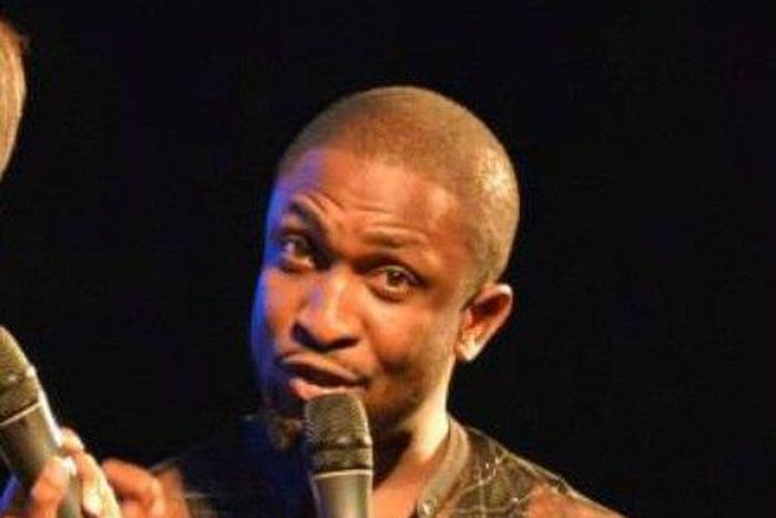 Darey Art-Alade in a black sheer top