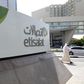 A man walks past a sign at the headquarters of telecommunications company Etisalat in Dubai October 25, 2011. REUTERS/Jumana El Heloueh