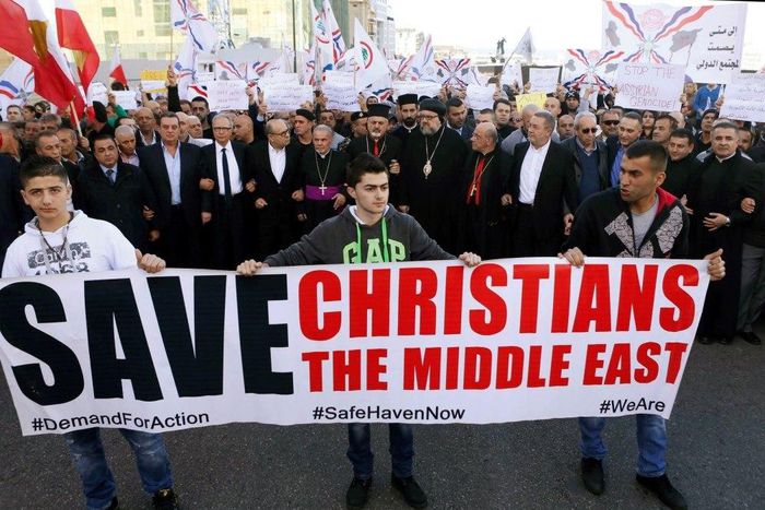 Assyrians hold banners as they march in solidarity with the Assyrians abducted by Islamic State fighters in Syria earlier this week, in Beirut, Labanon, February 28, 2015. Militants in northeast Syria are now estimated to have abducted at least 220 Ass...