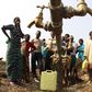 Congolese refugees, displaced by fighting between the Congo army and rebel group Allied Democratic Forces (ADF) last week, gather around dry water taps at Bukanga transit camp in Bundibugyo town camp, 376km (238 miles) southwest of Kampala July 17, 201...