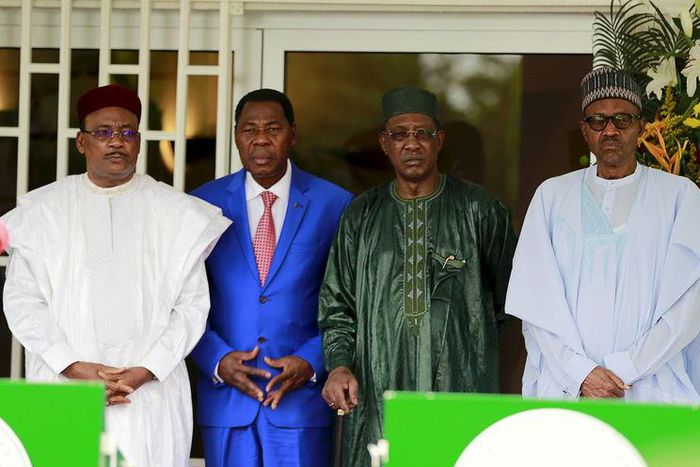 Niger's President Mahamadou Issoufou, Benin's President Thomas Boni Yayi, Chad's President Idriss Deby and Nigeria's President Muhammadu Buhari (L-R) pose during the presentation of the communique of the Summit of Heads of State and Government of The L...
