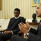 U.S. President Barack Obama meets with Nigerian President Muhammadu Buhari (L) in the Oval Office of the White House in Washington July 20, 2015. REUTERS/Kevin Lamarque