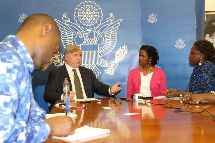 William Laidlaw speaking with journalists