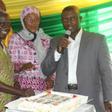 Dr. Afari Gyan cutting his birthday cake