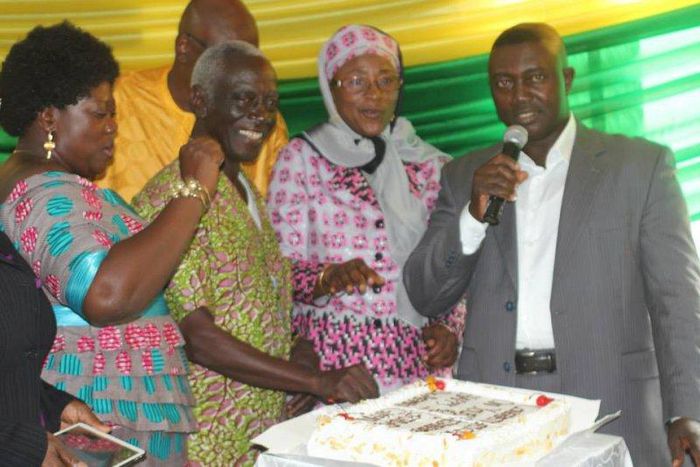Dr. Afari Gyan cutting his birthday cake