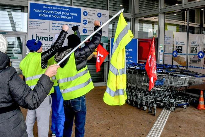 About 30 "yellow vest" protestors joined striking employees at a hardware store in Englos, northern France, on Friday who were seeking higher pay