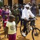 President Pierre Nkurunziza rides a bicycle as he heads to the venue where he voted in at a polling station in his rural home in Ngozi during a parliamentary election in Burundi June 29, 2015. REUTERS/Stringer
