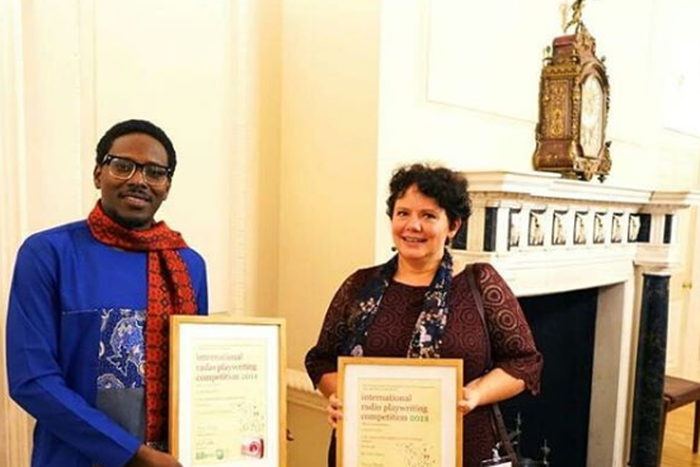 Bode Asiyanbi with his award and another recipient. [ Instagram]