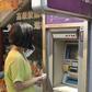 Xiao Liu standing by the ATM that electrocuted her