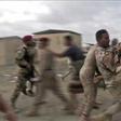 Loyalist Yemeni troops rush a wounded comrade for treatment after a rebel drone strike that killed six and wounded 12, including top brass