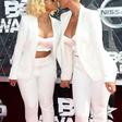 Amber Rose and Blac Chyna share a kiss at the 2015 BET Awards