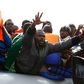 A group of 104 sub-Saharan Africans on board a rubber dinghy reach out for life jackets tossed to them by rescuers of the NGO Migrant Offshore Aid Station (MOAS) some 25 miles off the Libyan coast, in this October 4, 2014 file photo.    REUTERS/Darrin ...