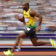 Asafa Powell of Jamaica runs on his way to winning his 100m heat round 1 during the London 2012 Olympic Games at the Olympic Stadium August 4, 2012.     REUTERS/Phil Noble