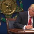Donald Trump signs an executive order banning citizens from seven majority-Muslim countries from entering the country