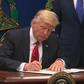 Donald Trump signs an executive order banning citizens from seven majority-Muslim countries from entering the country