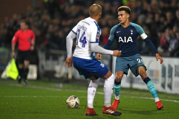 Dele Alli (R), pictured in against Tranmere's Jake Caprice, said Tottenham had "taken their foot off the gas"