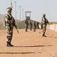 Algerian soldiers are seen at the Tiguentourine Gas Plant in In Amenas, 1600 km (994 miles) southeast of Algiers, January 31, 2013. REUTERS/Louafi Larbi