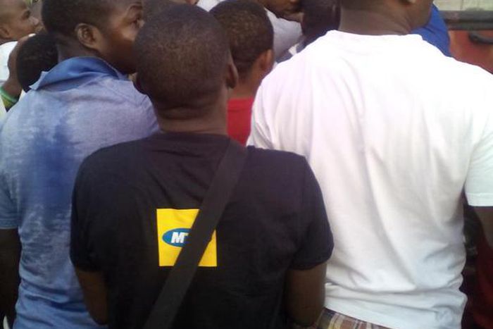 Commuters struggle to board a BRT in Lagos