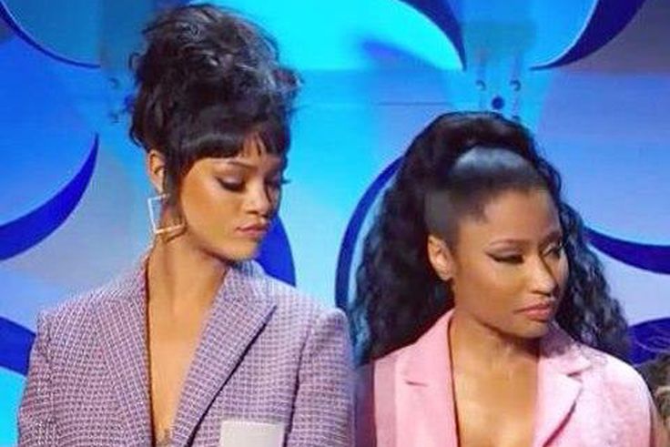 Rihanna peeps through Nicki Minaj's exposed cleavage