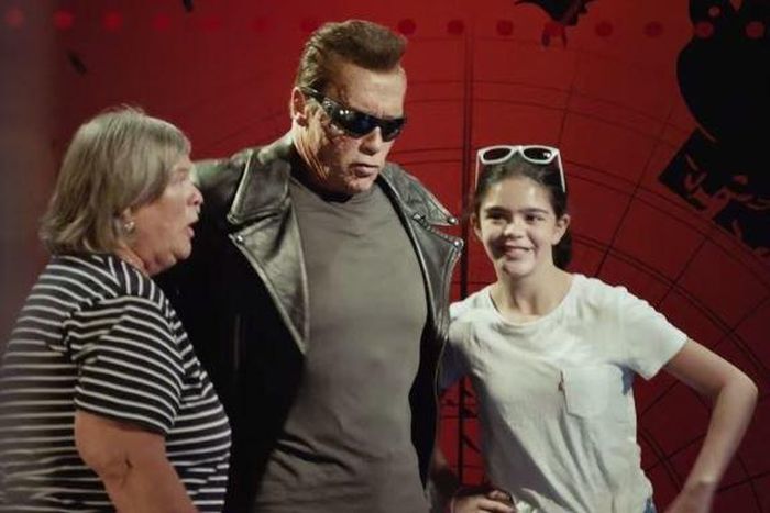 Arnold Schwarzenegger poses as Terminator wax works for fans