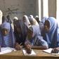 Primary school teacher and pupils in a Nigerian classsroom