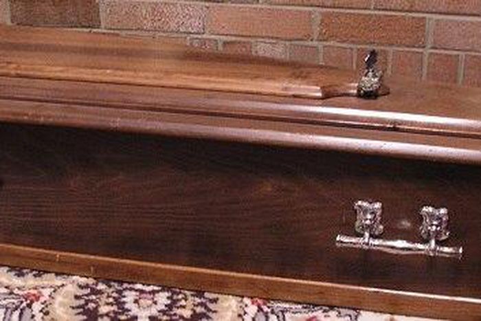 Dead woman comes back to life in a coffin.