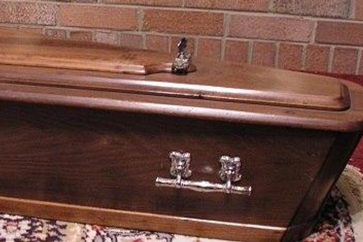 Dead woman comes back to life in a coffin.