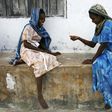 Girls play a game involving the picking up small stones in the village of Bwejuu on Zanzibar island, Tanzania, in a file photo. Picture taken December 2, 2007. REUTERS/Finbarr O'Reilly