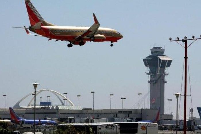 Wife of Chinese professor held denounces spying charges