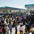 Hundreds of people line up to buy gasoline at a station in Morelia, Mexico amid spiralling shortages