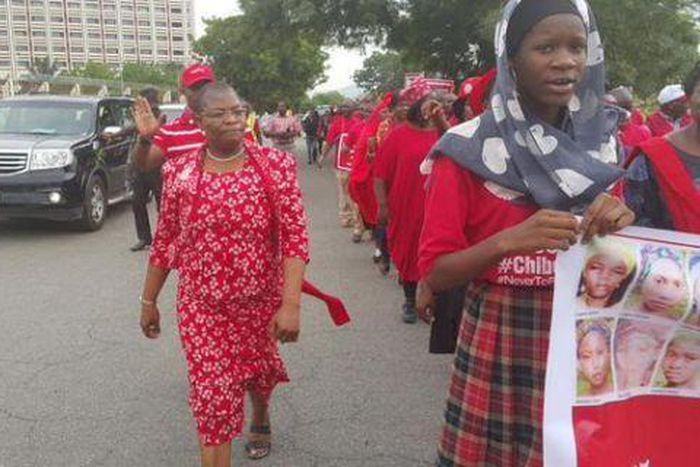 Members of BringBackOurGirls campaign group march to meet with President Muhammadu Buhari