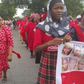 Members of BringBackOurGirls campaign group march to meet with President Muhammadu Buhari
