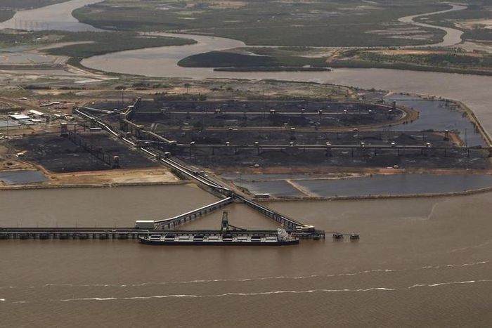A coal ship waits to be loaded at the port in Gladstone, Queensland, in a file photo. REUTERS/Daniel Munoz