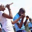 Seyi Shay singing to the children