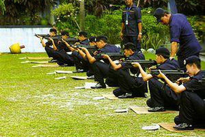 Malaysia detains 12 police officers