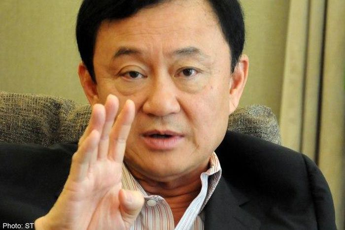 Thailand revokes passports of ousted former PM Thaksin
