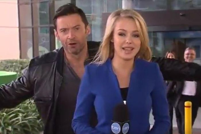 Hugh Jackman photo-bombing a news reporter