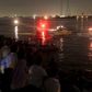 People gather along the banks of the Nile River during a search for the victims of a boat accident on the River Nile in the Warraq area of Giza, Egypt, early July 23, 2015 REUTERS/Mohamed Abd El Ghany