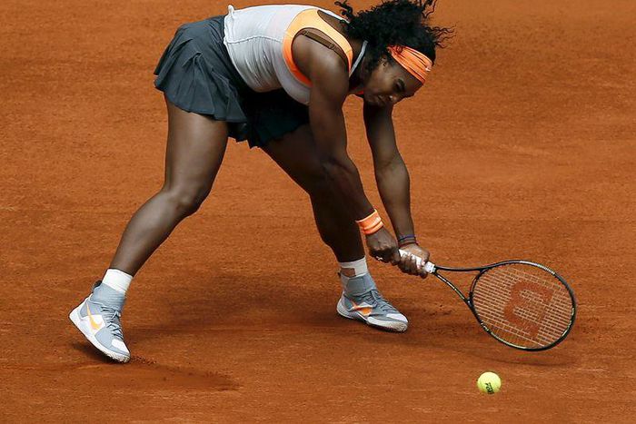 Serena Williams of the U.S. tries to return the ball to Petra Kvitova of the Czech Republic during their semi-final match at the Madrid Open tennis tournament in Madrid, Spain, May 8, 2015. REUTERS/Andrea Comas