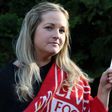 Caroline Waine of Woolton. Caroline had to withdraw from the Echo Win a Wedding Competition after the death of her fiancé, Stuart Murphy, from cancer. Pictured here with his Liverpool FC blanket and photograph