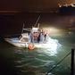 A migrant boat spotted by a French patrol in the Channel, where the number of attempted crossings from France to Britain has surged