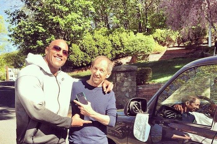 Dwayne 'The Rock' Johnson poses with Audie Bridges after bashing his truck's side mirror on his way to movie set