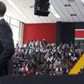 People listen as U.S. President Barack Obama delivers remarks at an indoor stadium in Nairobi July 26, 2015. Obama told Kenyans on Sunday on his first presidential trip to his father's homeland that there was "no limit to what you can achieve" but said...
