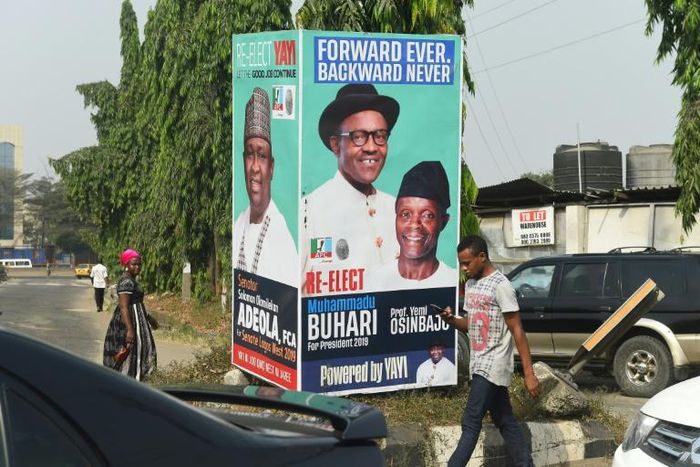 Election time: A campaign poster in Lagos for President Muhammadu Buhari and Vice President Yemi Osinbajo, contending next month's polls