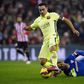 Barcelona's Xavi Hernandez passes Athletic Bilbao goalkeeper Gorka Iraioz during their Spanish first division soccer match at San Mames stadium in Bilbao, February 8, 2015. REUTERS/Vincent West