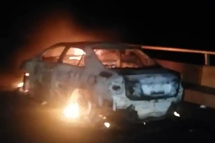 The burning sedan car.