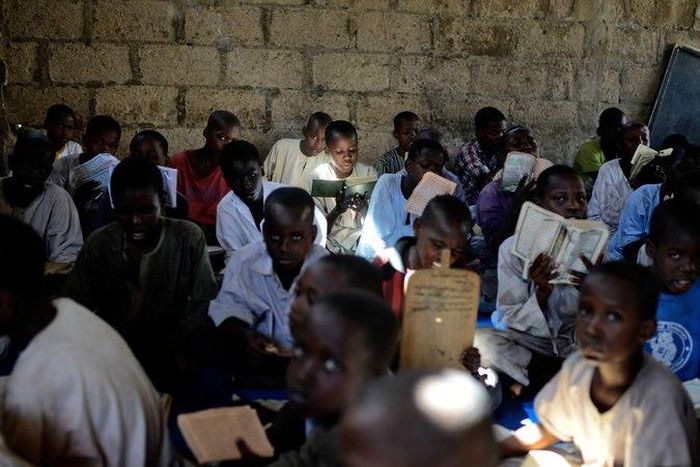 Nigerian children studying the Quran